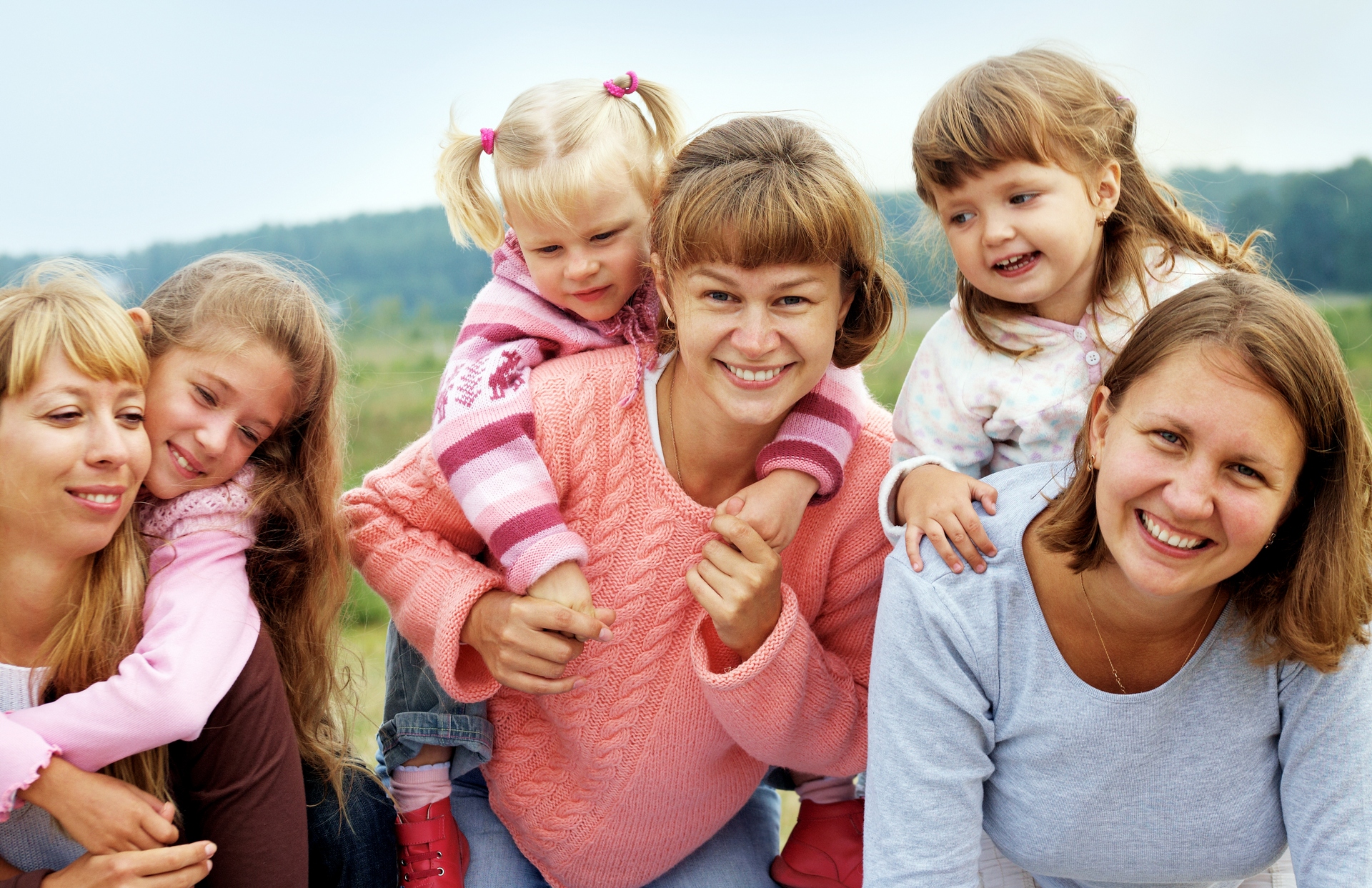 Three mothers have a good time with three daughters outdoors