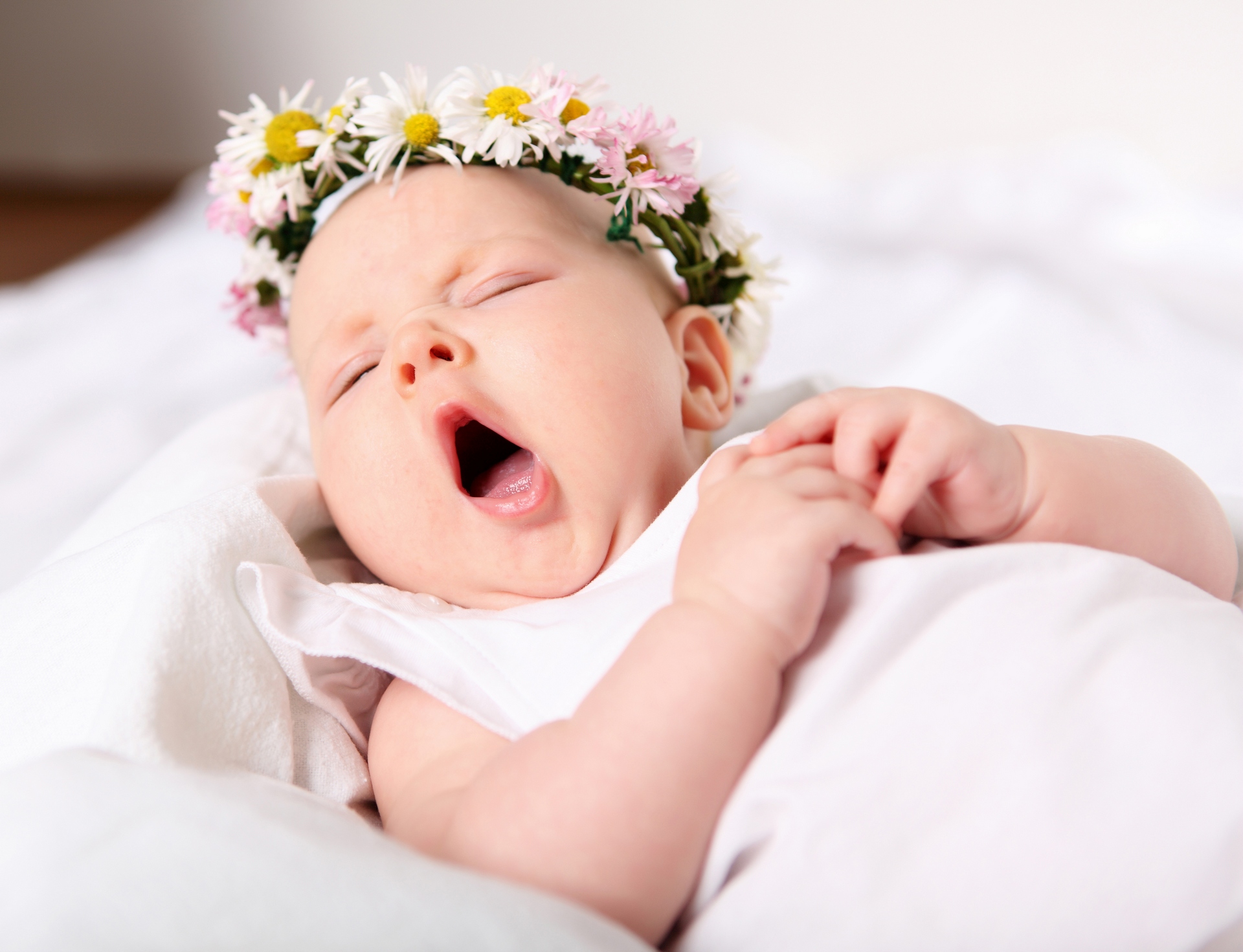 Portrait of a yawning baby girl